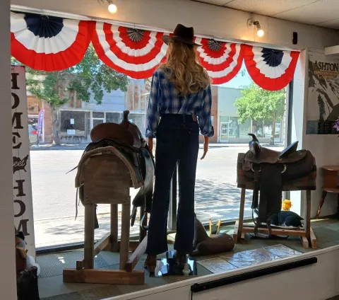 A vintage saddle in the large window